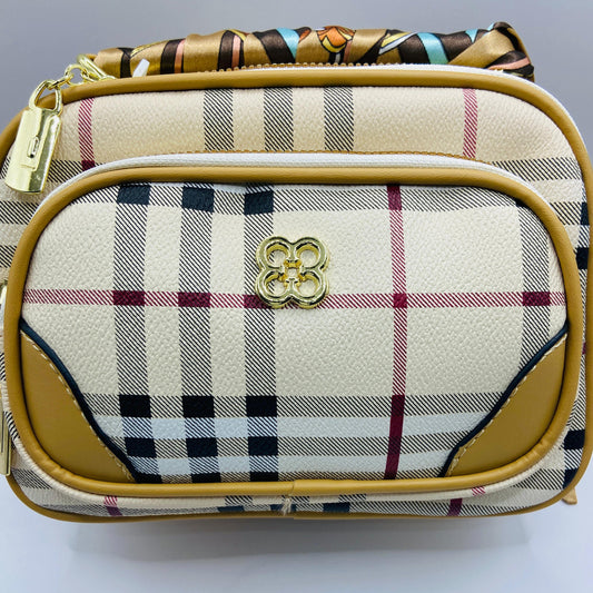 This handbag is a structured, genuine leather tote-style bag designed for modern women who value both elegance and functionality.