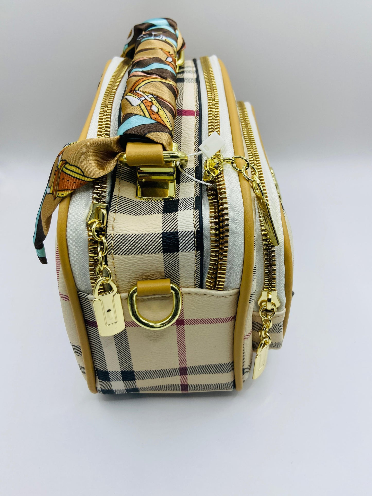 This handbag is a structured, genuine leather tote-style bag designed for modern women who value both elegance and functionality.