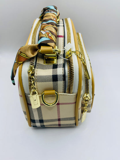 This handbag is a structured, genuine leather tote-style bag designed for modern women who value both elegance and functionality.