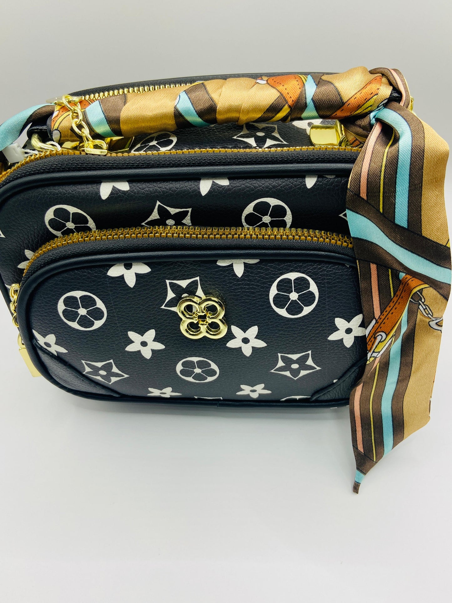 This handbag is a structured, genuine leather tote-style bag designed for modern women who value both elegance and functionality.