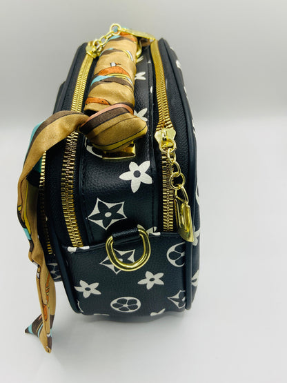 This handbag is a structured, genuine leather tote-style bag designed for modern women who value both elegance and functionality.
