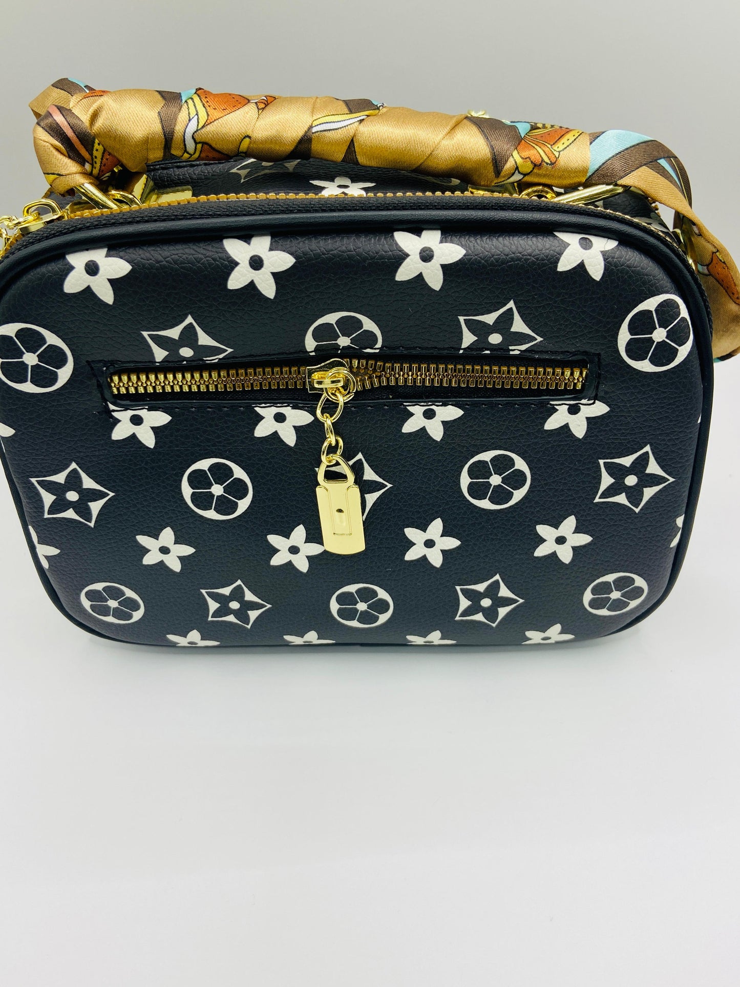 This handbag is a structured, genuine leather tote-style bag designed for modern women who value both elegance and functionality.