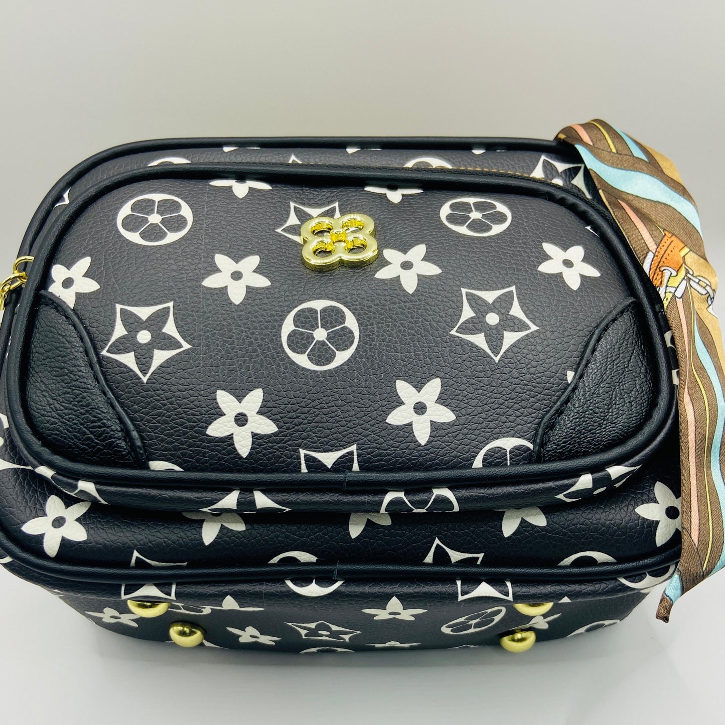 This handbag is a structured, genuine leather tote-style bag designed for modern women who value both elegance and functionality.