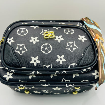 This handbag is a structured, genuine leather tote-style bag designed for modern women who value both elegance and functionality.