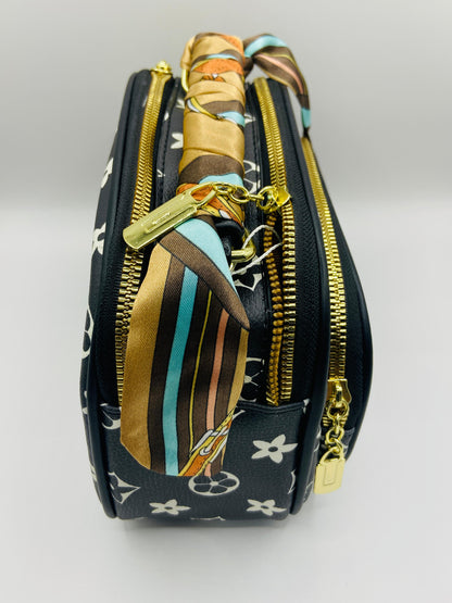 This handbag is a structured, genuine leather tote-style bag designed for modern women who value both elegance and functionality.