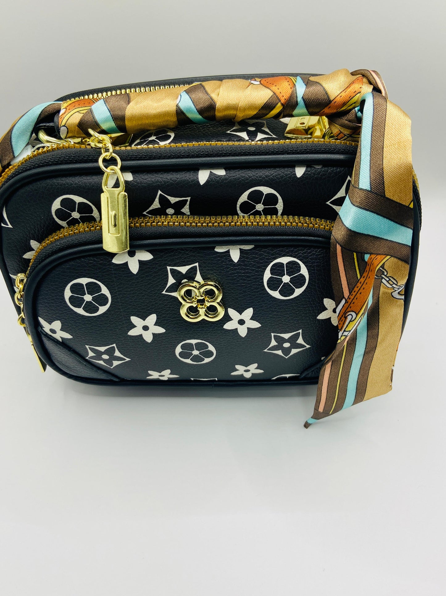 This handbag is a structured, genuine leather tote-style bag designed for modern women who value both elegance and functionality.