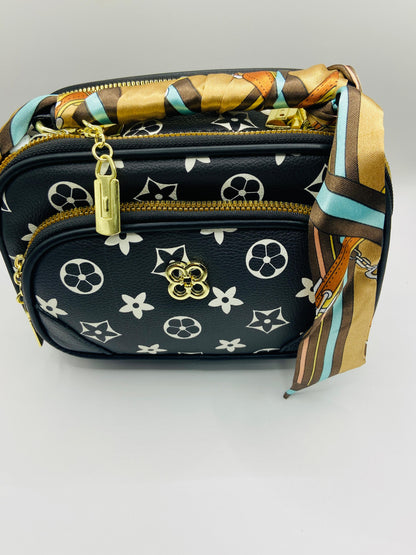 This handbag is a structured, genuine leather tote-style bag designed for modern women who value both elegance and functionality.