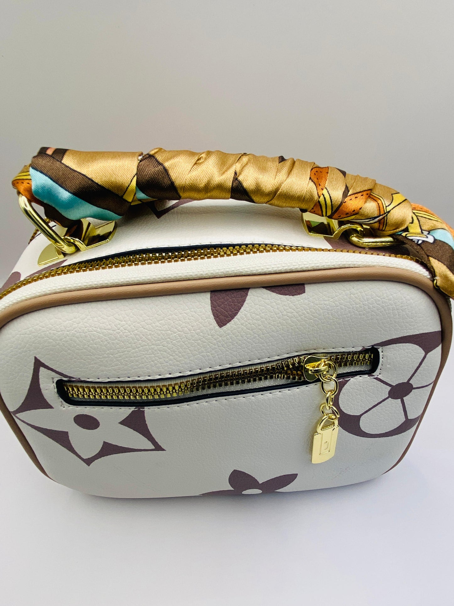 This handbag is a structured, genuine leather tote-style bag designed for modern women who value both elegance and functionality.