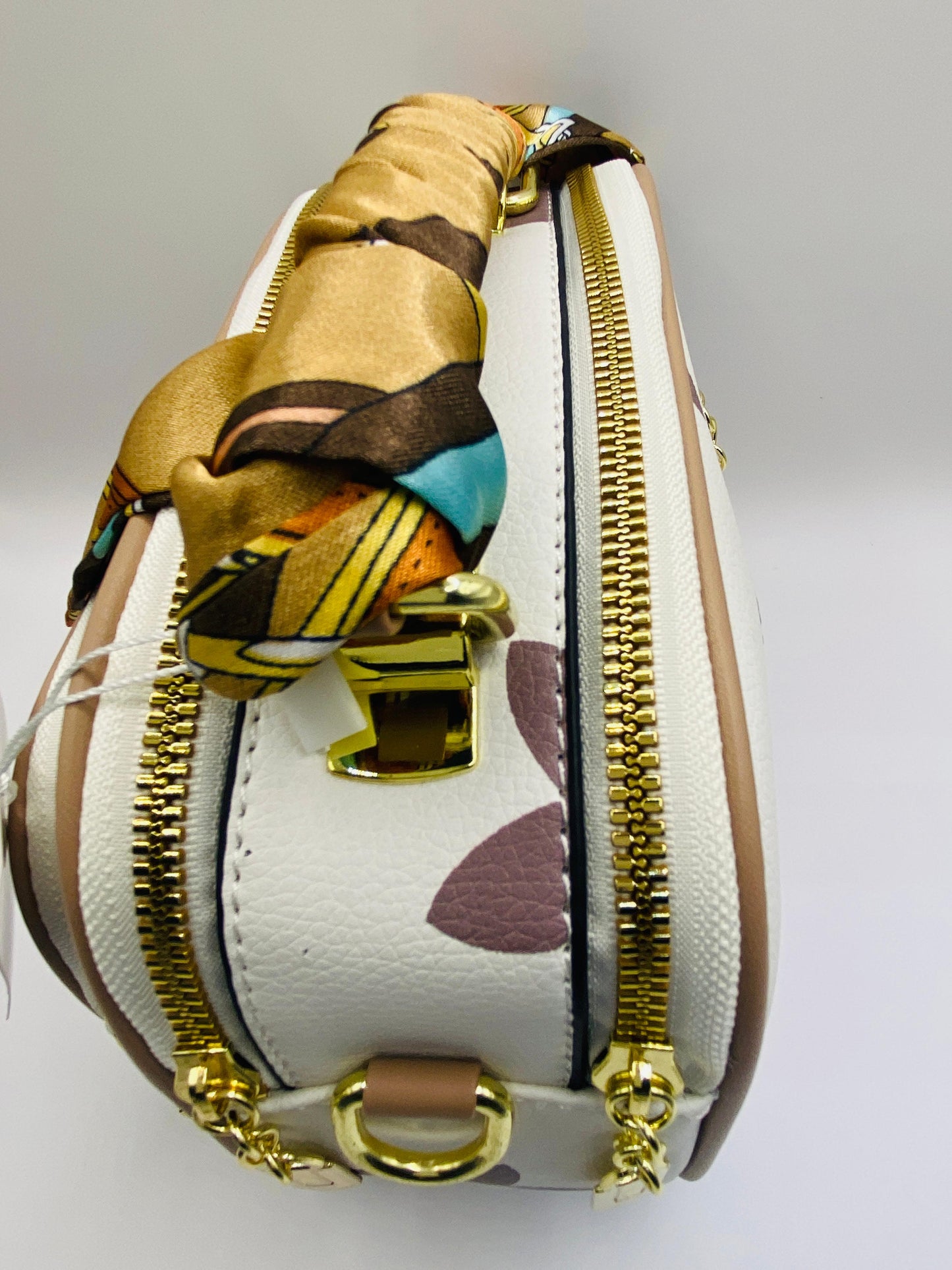 This handbag is a structured, genuine leather tote-style bag designed for modern women who value both elegance and functionality.