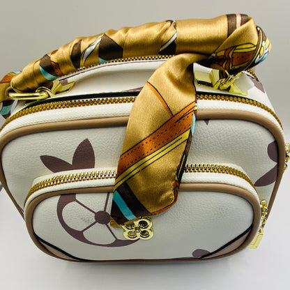 This handbag is a structured, genuine leather tote-style bag designed for modern women who value both elegance and functionality.