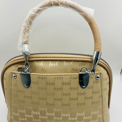 This handbag is a structured, genuine leather tote-style bag designed for modern women who value both elegance and functionality.