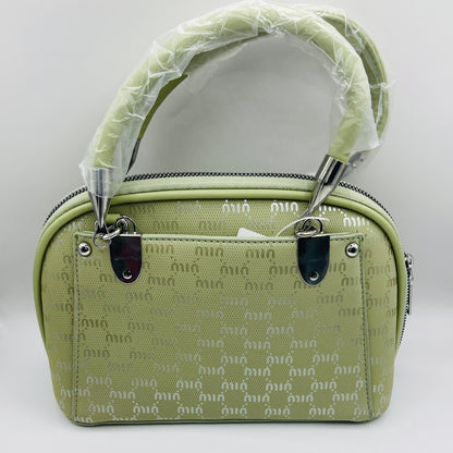 This handbag is a structured, genuine leather tote-style bag designed for modern women who value both elegance and functionality.