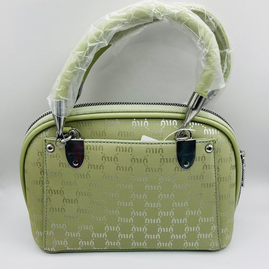 This handbag is a structured, genuine leather tote-style bag designed for modern women who value both elegance and functionality.