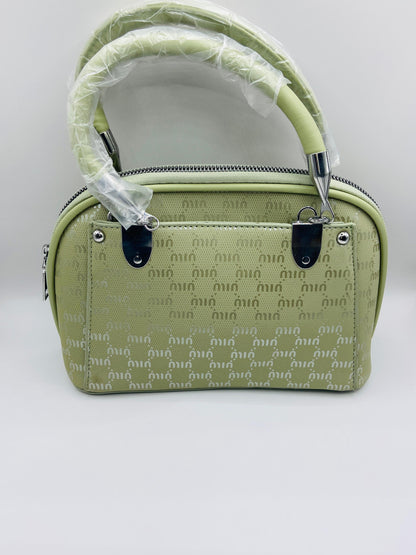 This handbag is a structured, genuine leather tote-style bag designed for modern women who value both elegance and functionality.