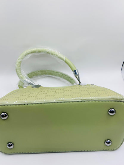 This handbag is a structured, genuine leather tote-style bag designed for modern women who value both elegance and functionality.