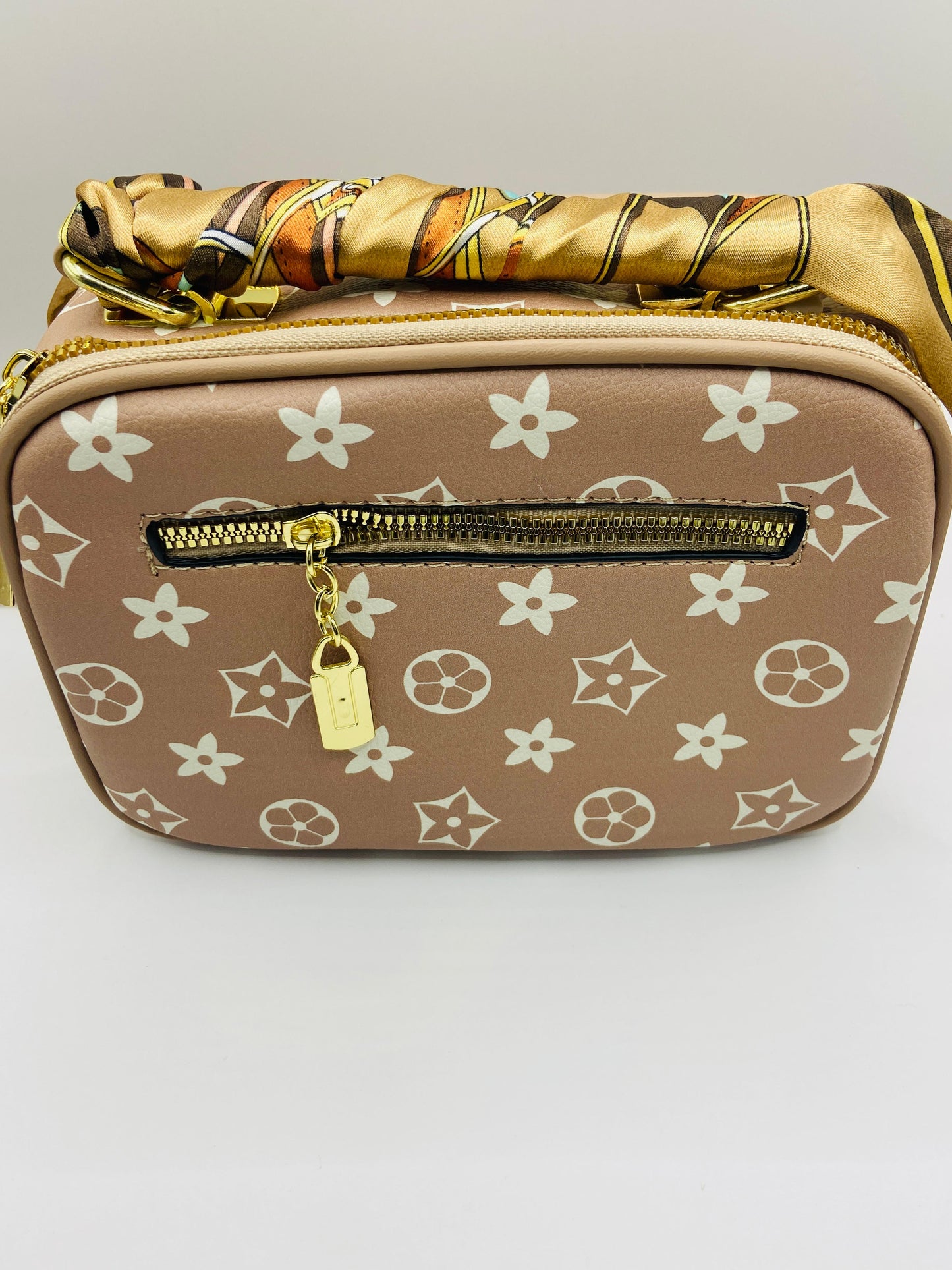This handbag is a structured, genuine leather tote-style bag designed for modern women who value both elegance and functionality.