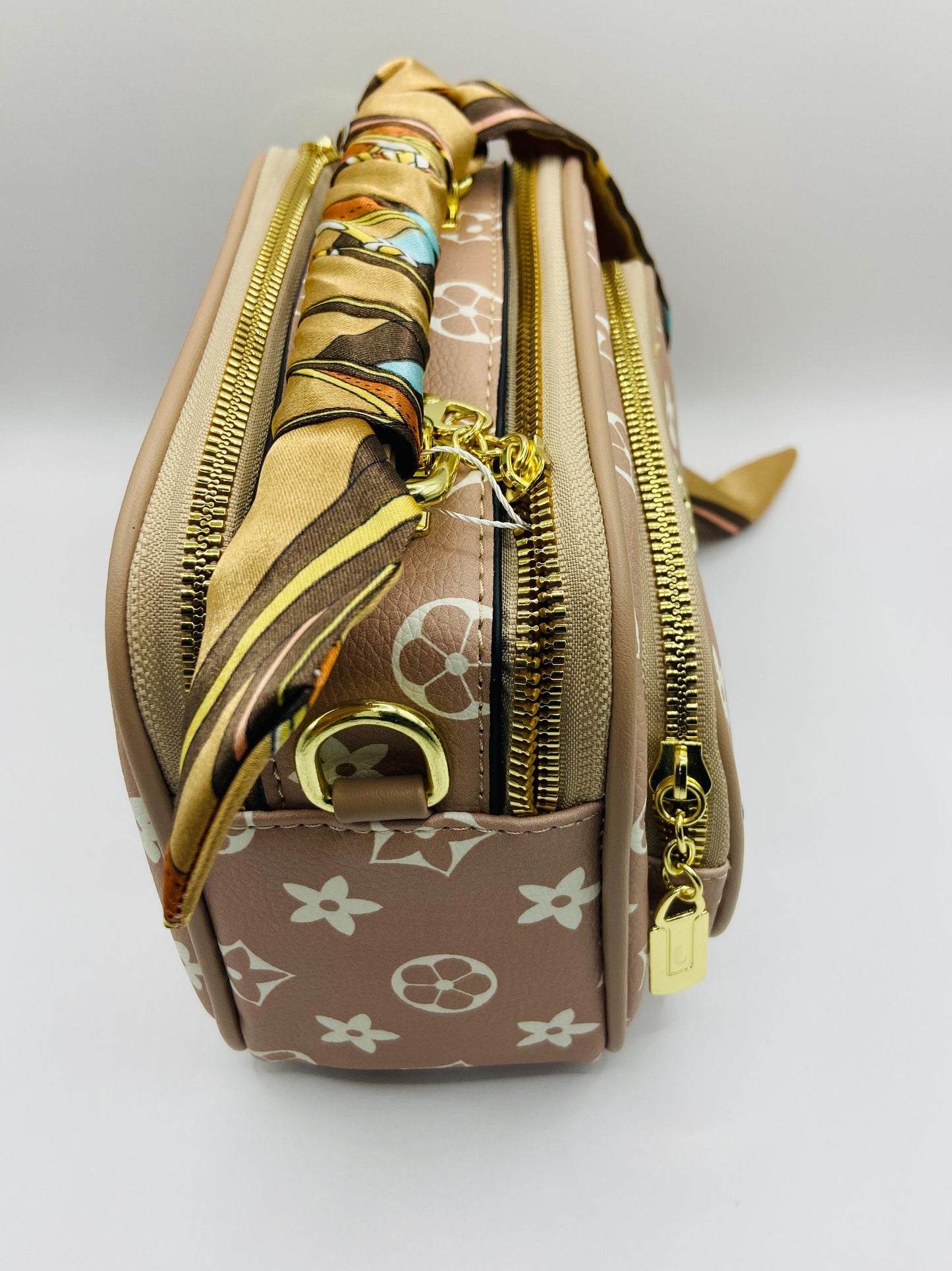 This handbag is a structured, genuine leather tote-style bag designed for modern women who value both elegance and functionality.