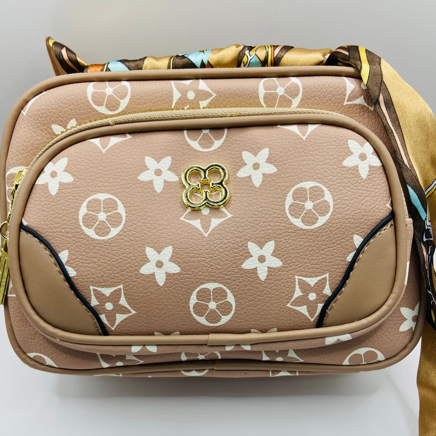 This handbag is a structured, genuine leather tote-style bag designed for modern women who value both elegance and functionality.
