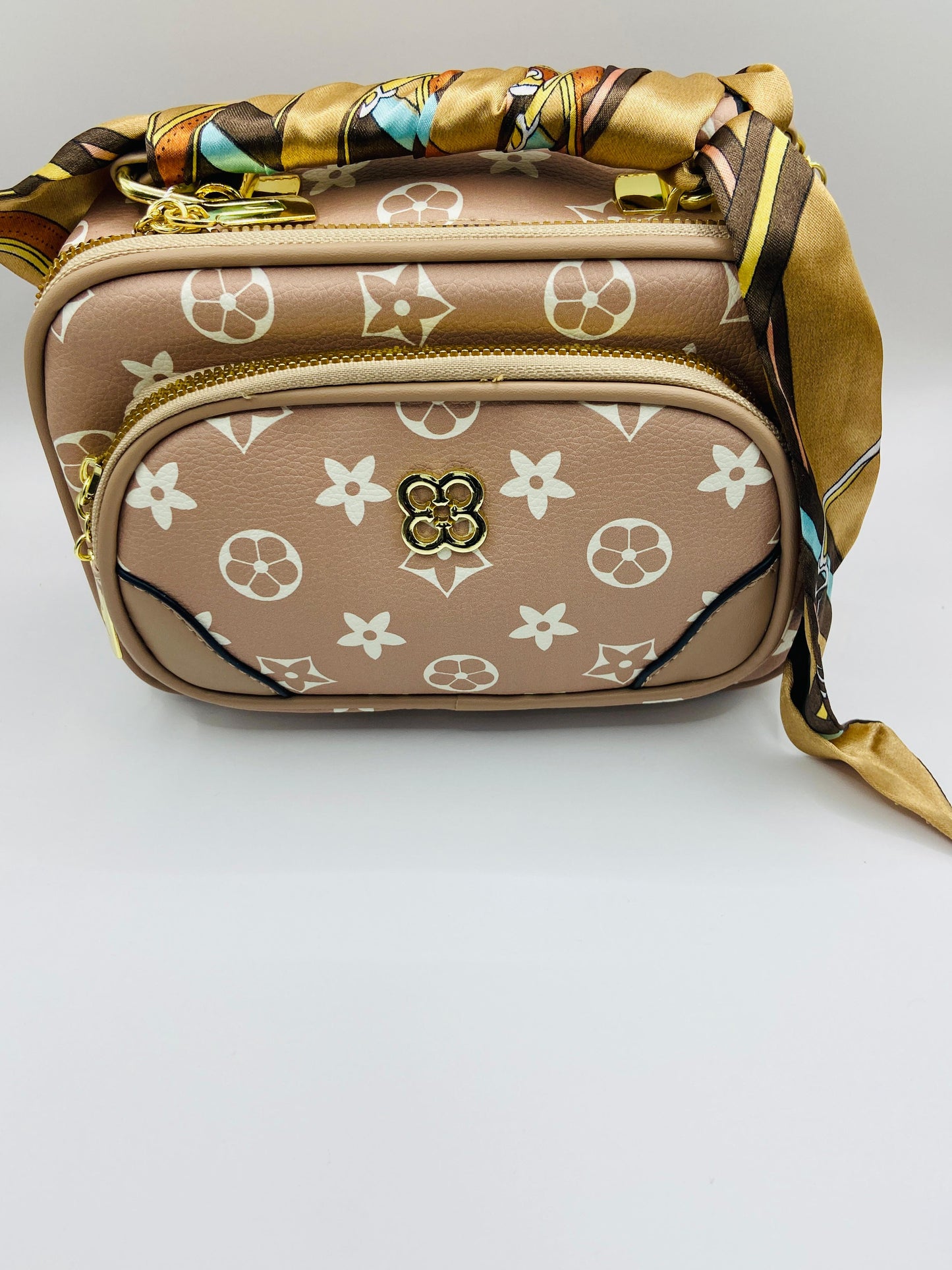 This handbag is a structured, genuine leather tote-style bag designed for modern women who value both elegance and functionality.