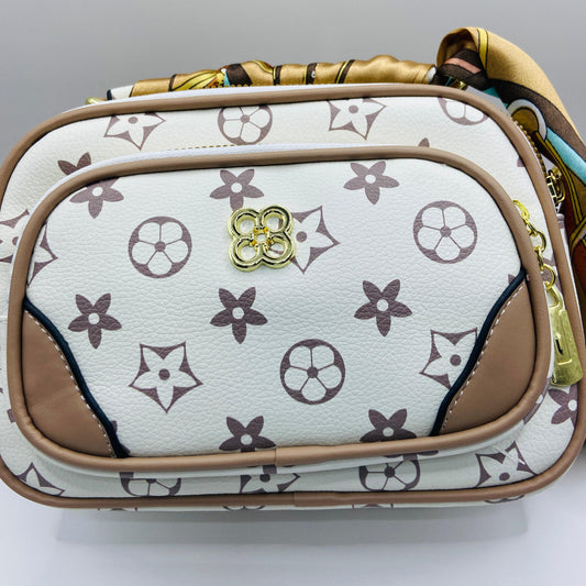 This handbag is a structured, genuine leather tote-style bag designed for modern women who value both elegance and functionality.