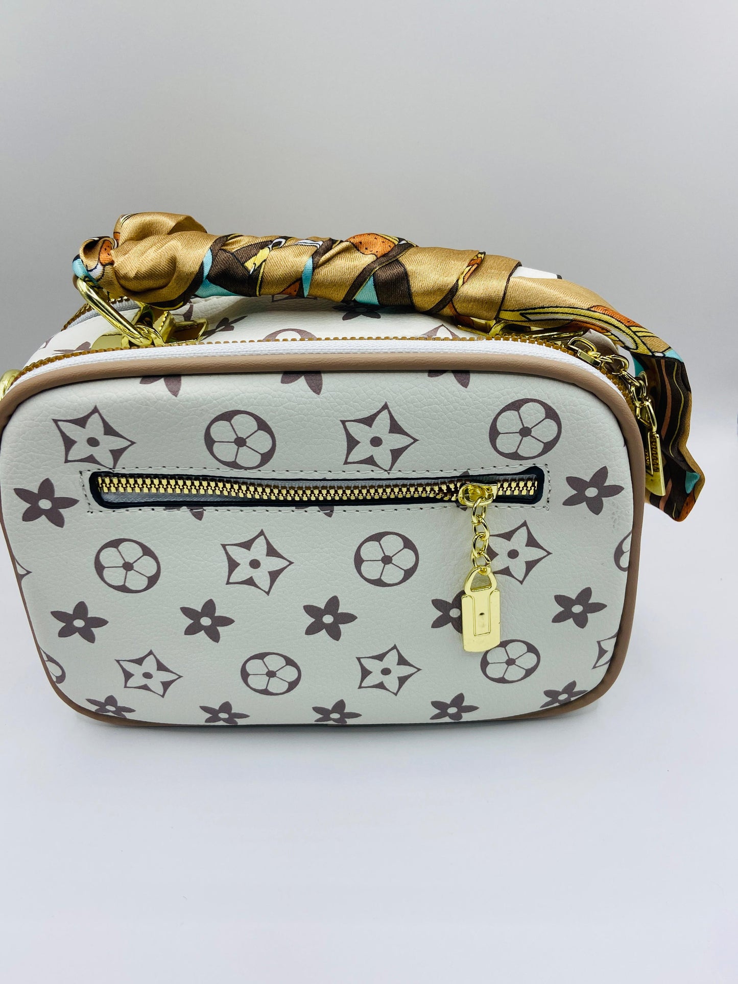 This handbag is a structured, genuine leather tote-style bag designed for modern women who value both elegance and functionality.