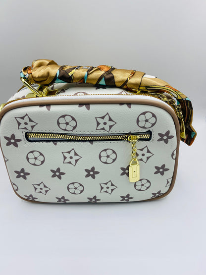This handbag is a structured, genuine leather tote-style bag designed for modern women who value both elegance and functionality.