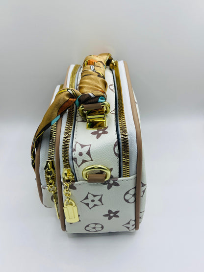 This handbag is a structured, genuine leather tote-style bag designed for modern women who value both elegance and functionality.