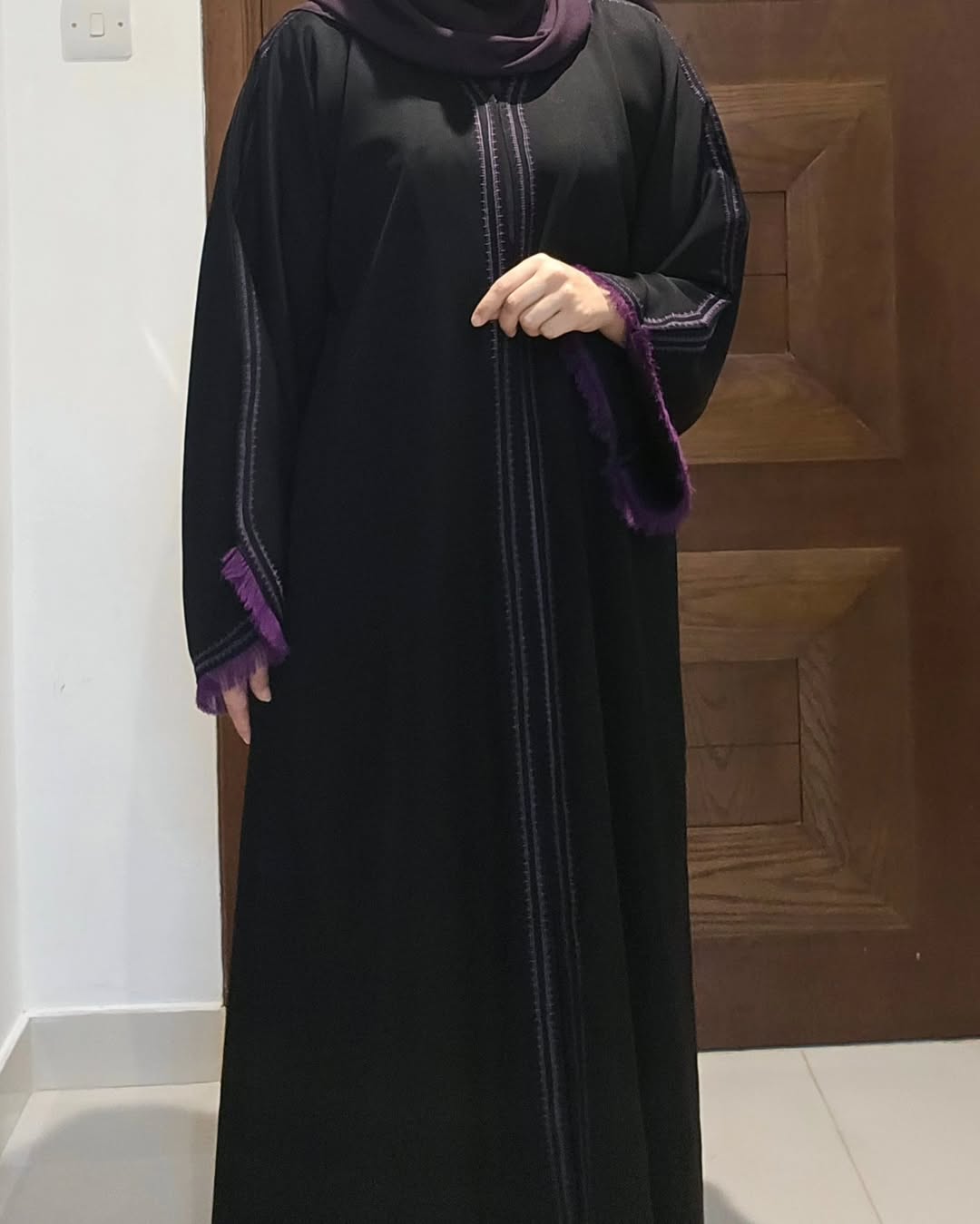 "Modern Elegance – Classic Black Abaya with a Touch of Purple Luxury"