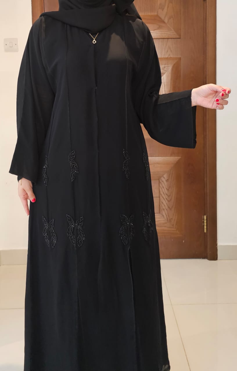 "Celestial Elegance – A Black Abaya with Sparkling Silver Star Embroidery"