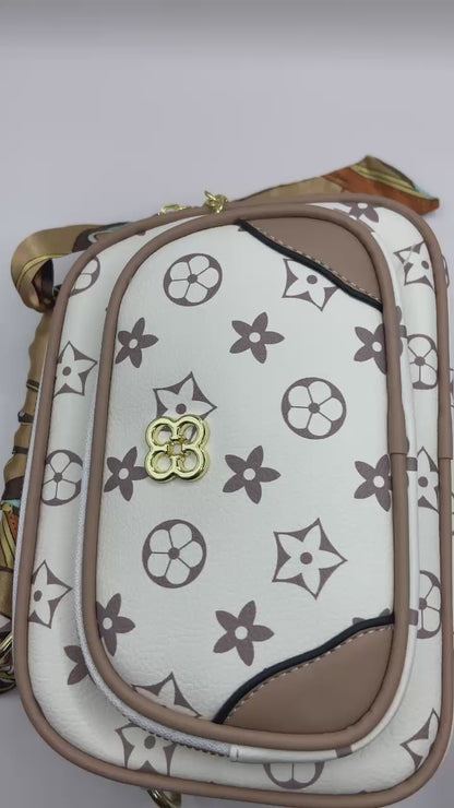 This handbag is a structured, genuine leather tote-style bag designed for modern women who value both elegance and functionality.