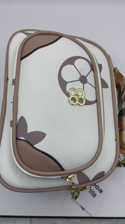 This handbag is a structured, genuine leather tote-style bag designed for modern women who value both elegance and functionality.