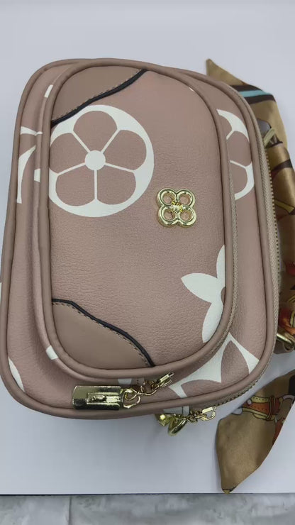 This handbag is a structured, genuine leather tote-style bag designed for modern women who value both elegance and functionality.