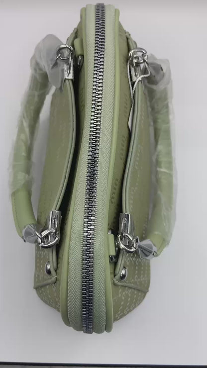 This handbag is a structured, genuine leather tote-style bag designed for modern women who value both elegance and functionality.