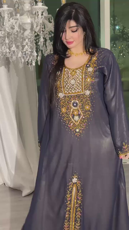 A luxurious abaya crafted from soft chiffon, embellished with delicate beaded embroidery extending down the bodice