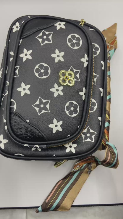 This handbag is a structured, genuine leather tote-style bag designed for modern women who value both elegance and functionality.