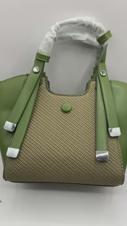 This handbag is a structured, genuine leather tote-style bag designed for modern women who value both elegance and functionality.