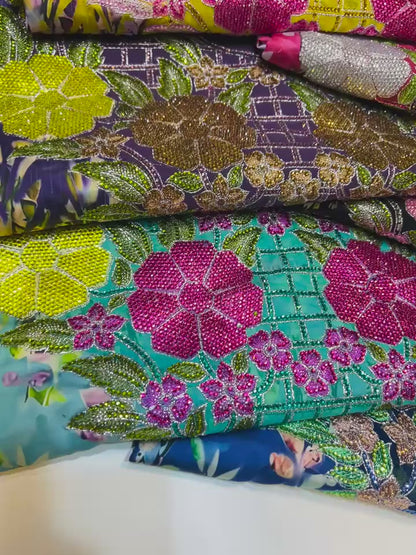 Italian raw silk fabric embellished with intricate embroidery featuring 6-pointed stones and an elegant hemline