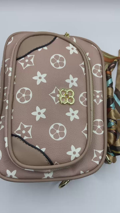 This handbag is a structured, genuine leather tote-style bag designed for modern women who value both elegance and functionality.