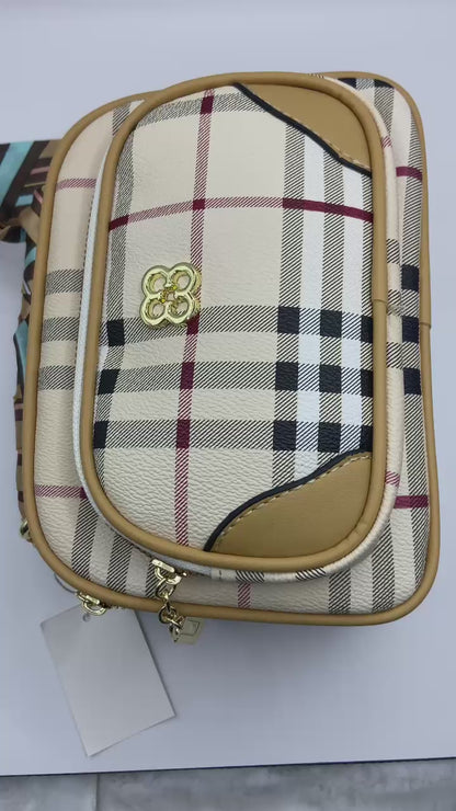 This handbag is a structured, genuine leather tote-style bag designed for modern women who value both elegance and functionality.