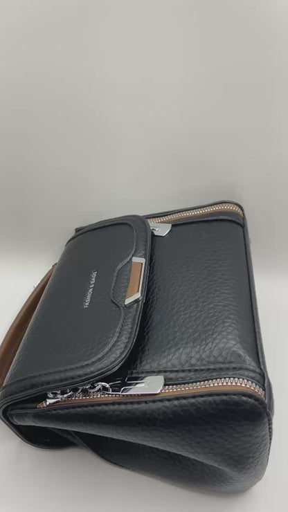 This handbag is a structured, genuine leather tote-style bag designed for modern women who value both elegance and functionality.