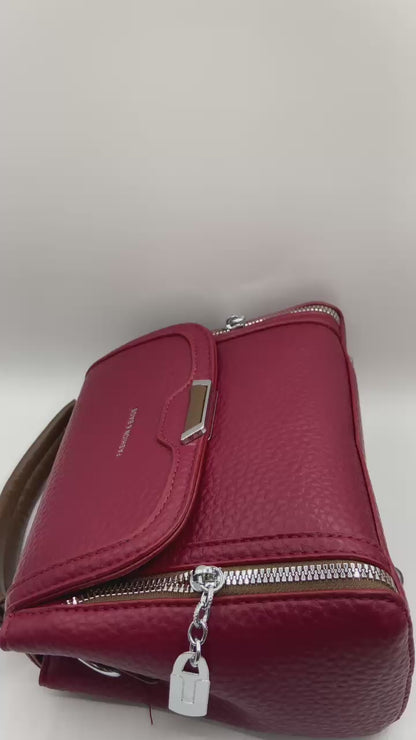This handbag is a structured, genuine leather tote-style bag designed for modern women who value both elegance and functionality.