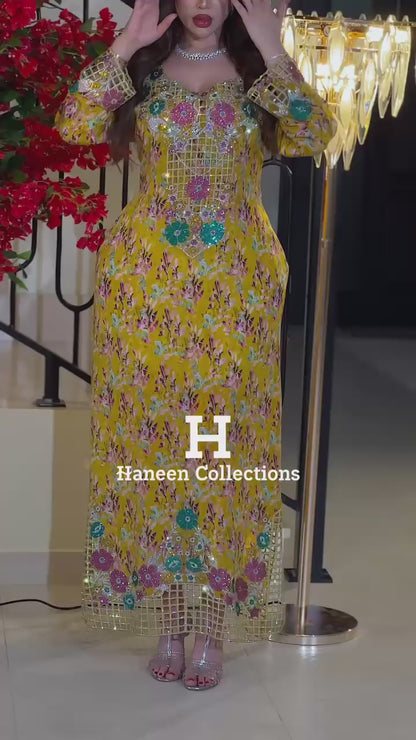 Italian raw silk fabric embellished with intricate embroidery featuring 6-pointed stones and an elegant hemline