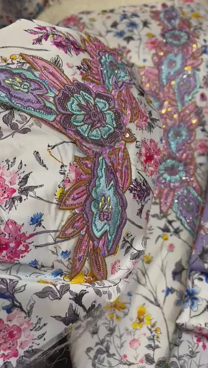 This authentic Italian silk fabric features intricate 3D embroidery with crystals and hand-beaded details