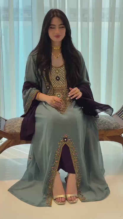 A luxurious abaya crafted from soft chiffon, embellished with delicate beaded embroidery extending down the bodice