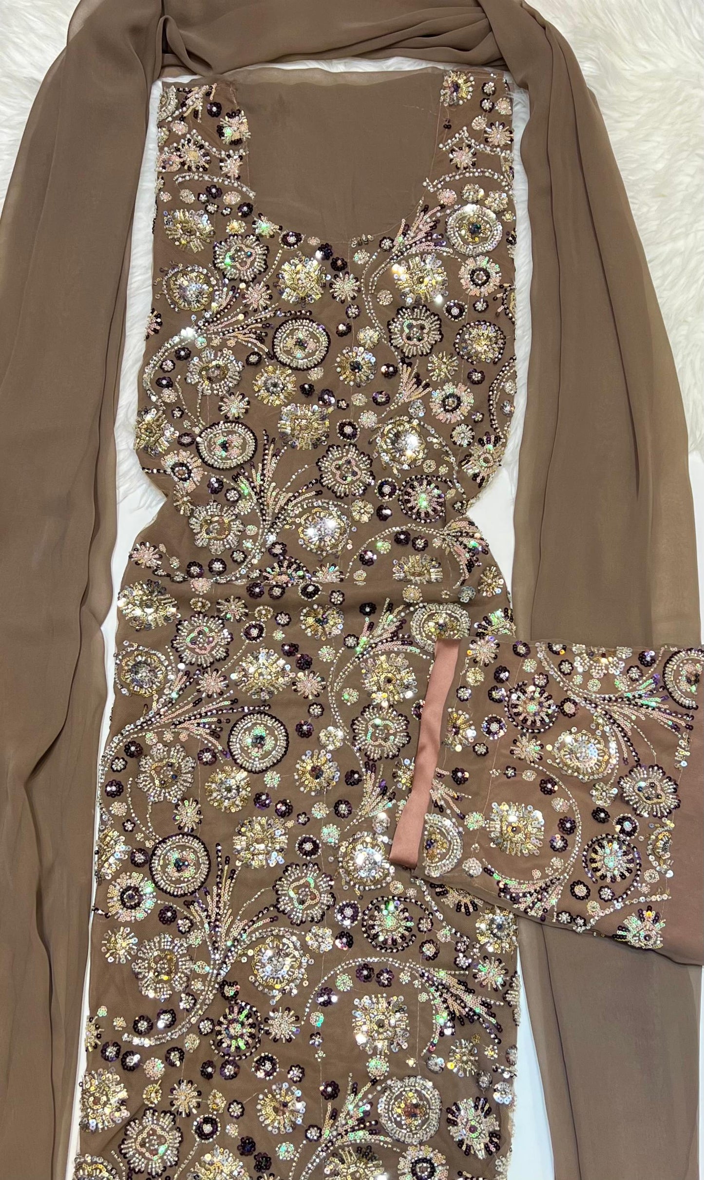 This luxurious dress is crafted from soft chiffon with an Armani silk