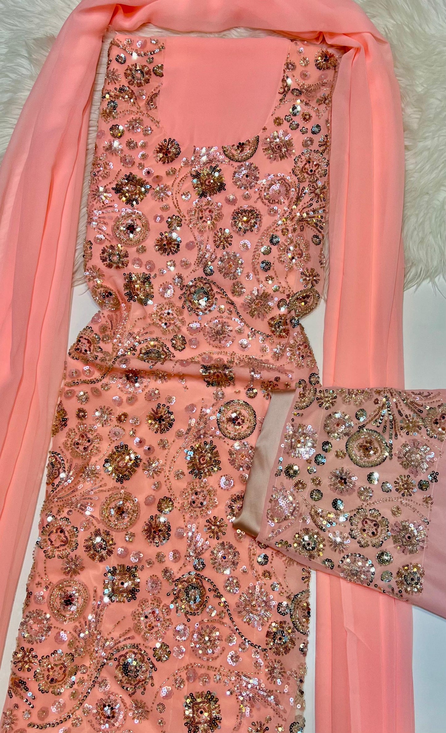 This luxurious dress is crafted from soft chiffon with an Armani silk