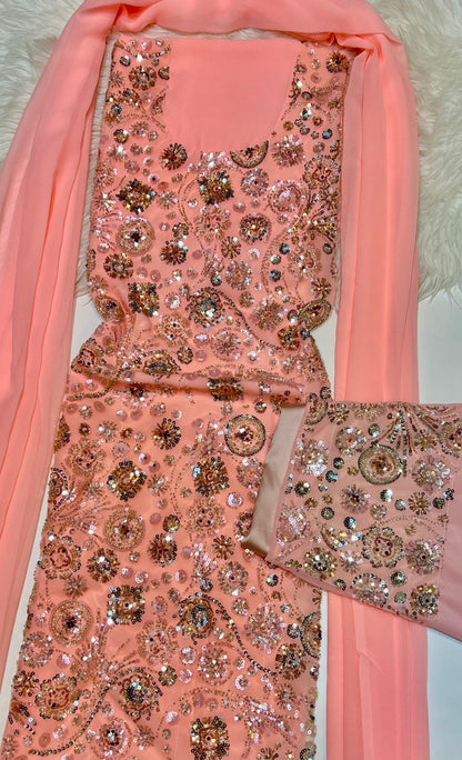 This luxurious dress is crafted from soft chiffon with an Armani silk