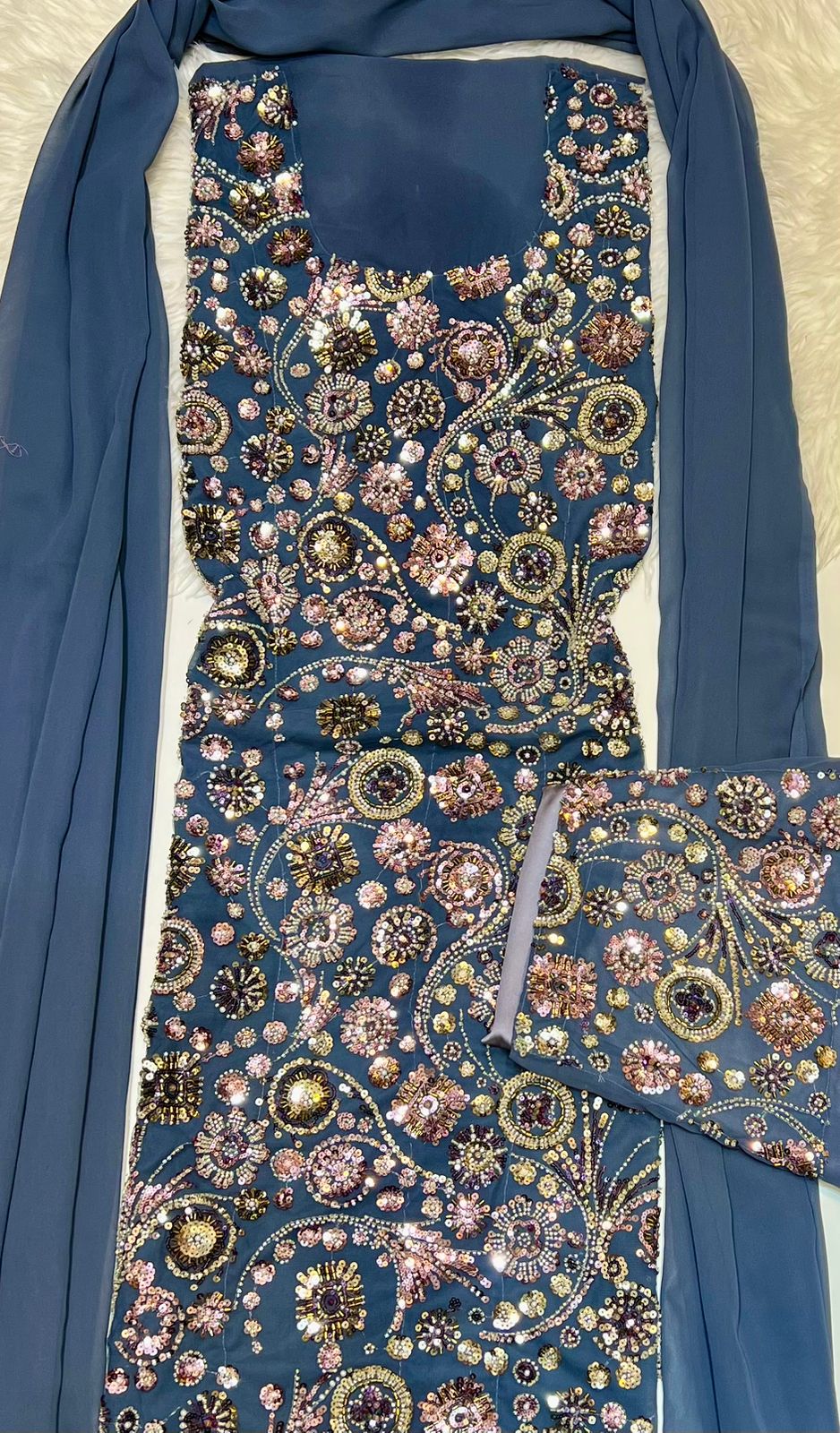 This luxurious dress is crafted from soft chiffon with an Armani silk